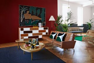 Image may contain Living Room Room Indoors Furniture Table Coffee Table Couch Interior Design Lobby and Wood