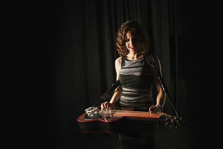 Abbie Gardner playing slide guitar