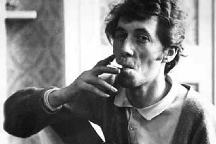 black and white photo of Bert Jansch smoking