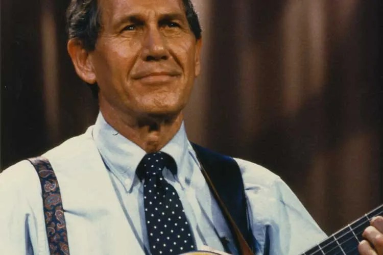 Chet Atkins playing guitar