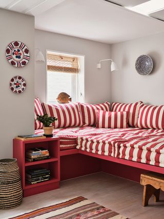 Image may contain Cushion Pillow Furniture Living Room Room Indoors Bedroom Couch Interior Design and Dorm Room