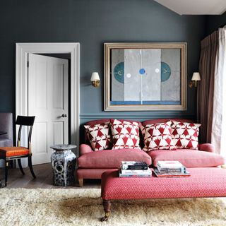 Image may contain Furniture Living Room Room Indoors Couch Chair Home Decor Cushion Pillow and Interior Design