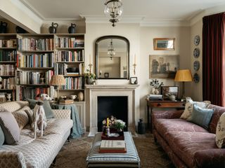 Interior designer Charlotte Boundy has brought warmth and colour  to her house in Shepherds Bush. Candle sconces frame...