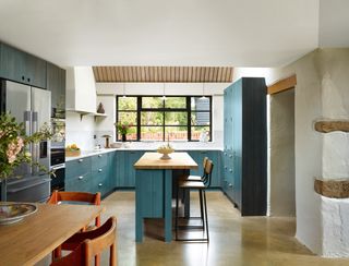 Together with the Crittall windows and larch ceiling the polished concrete floor and walls painted in Farrow  Balls...