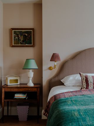 Image may contain Lamp Bed Furniture Table Lamp Indoors Interior Design Cushion and Home Decor